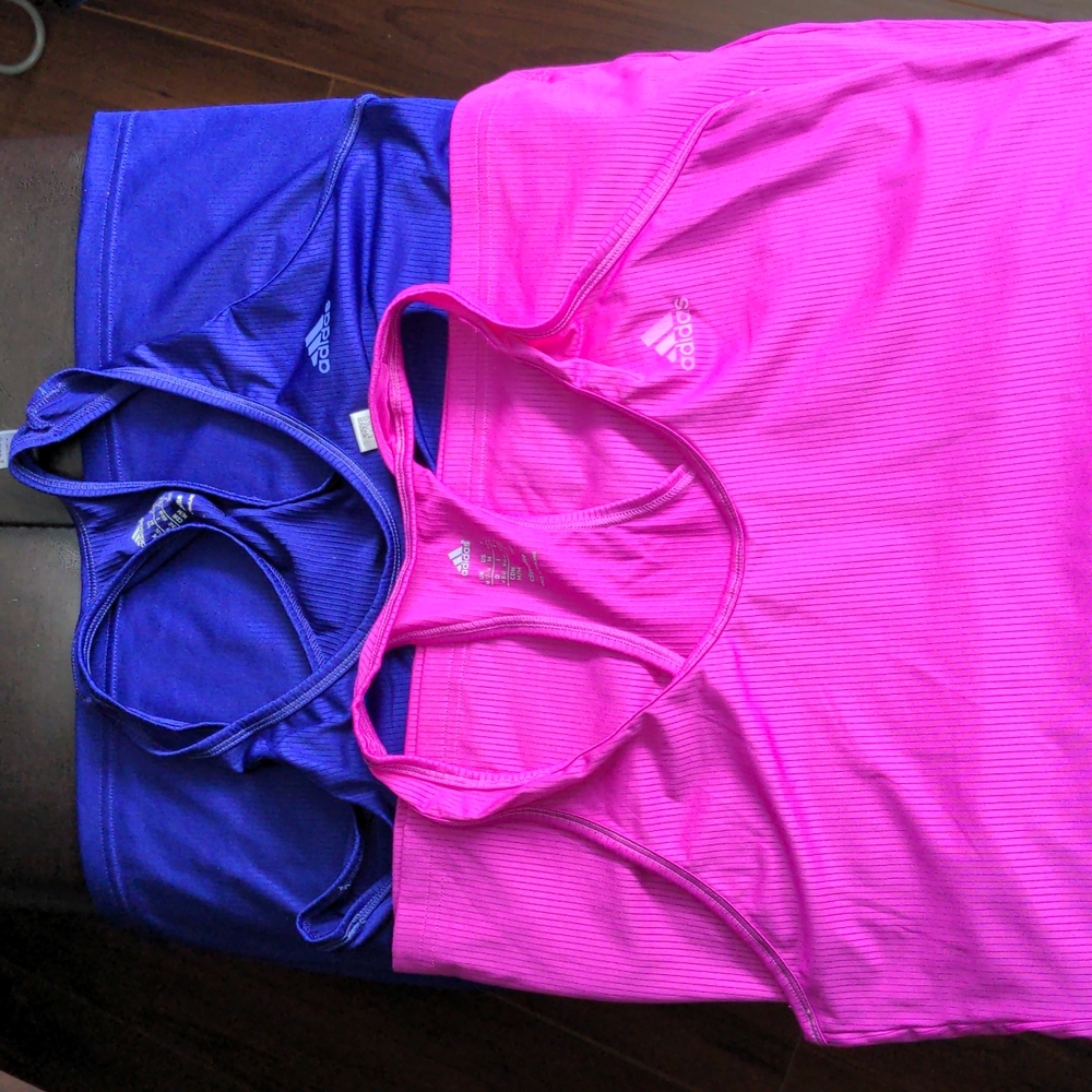 2 medium Adidas climalite workout tanks. (pink and darker purple)